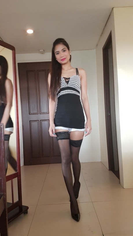Cute girl: Filipina Hazel Garcia strips to her stockings and has her pussy fingered.