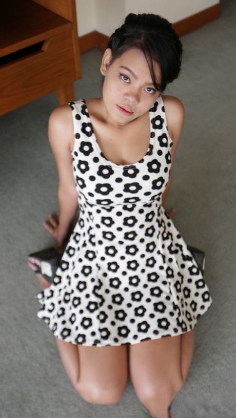 Amateur Thai Wa displays her captivating breasts as she is rammed into them.