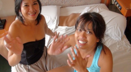 Lovely Filipina MILFs with a hard penis join an amateur threesome.