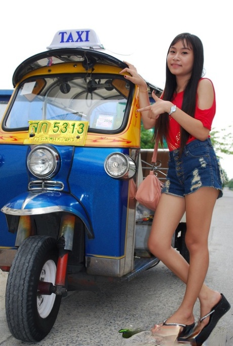 Pretty Asian Bew wears booty shorts and rides in a tuk tuk while flaunting her radiant legs.