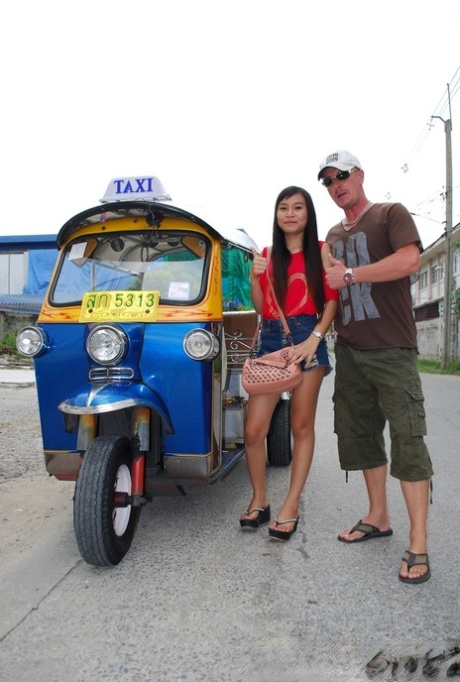 While wearing booty shorts, Pretty Asian Bew flaunts her hottest legs while riding in a tuk tuk.