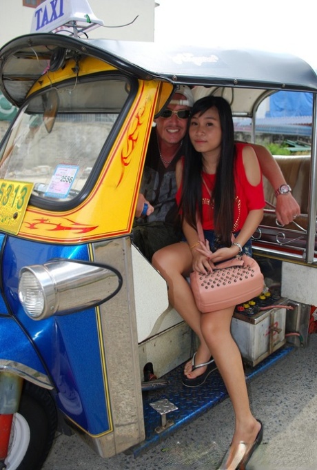 Bew, who is of Asian descent, rides in a tuk-tuk and displays her radiant legs in booty shorts.