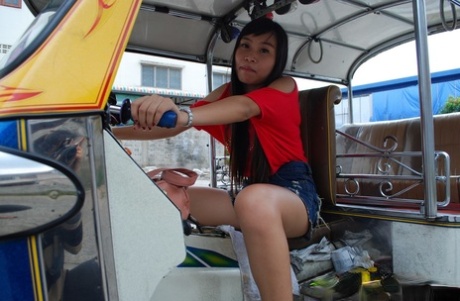 Despite her Asian heritage, Bew flaunts stylish booty shorts while riding in the back of a tuk tuk.