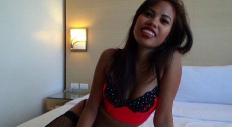 Filipina kinky Zara Dimaano toys with her fishnets while flaunting her radiant figure.
