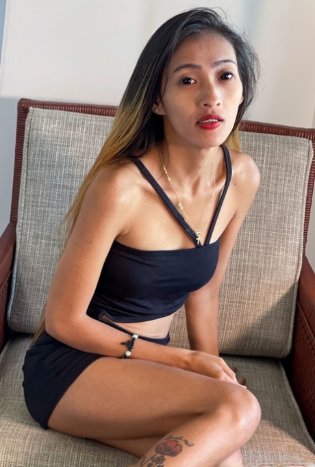 Gorgeous Asian babe Mjane shows off her petite body in a sexy black outfit