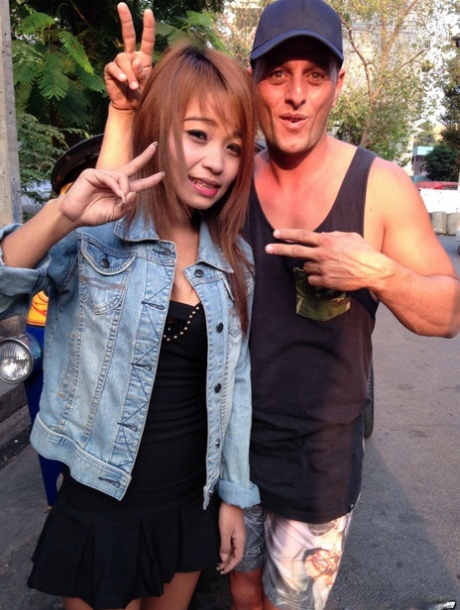 Cute mom Brownie from Thailand has her hair rubbed off by white guy in an adorable comb pose.