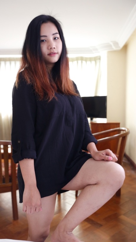 Up close and personal: Beautiful Asian babe Meew shows off her stunning big breasts.