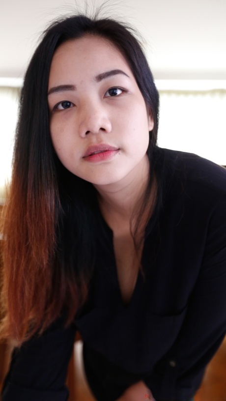 Impressive Asian female Meew exhibits her stunning large breasts in close proximity.