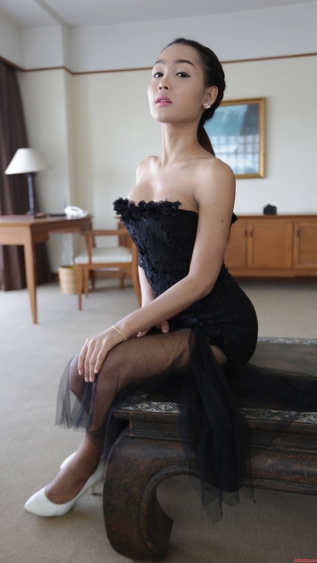 Pretty Asian Shemale Shows Her Tiny Tits While Teasing In A Sexy Black Dress