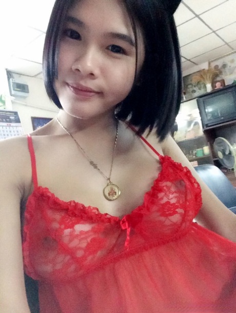 Gogo, an attractive Asian female, poses without a top and appears radiant in hot clothing for some sexy selfies.