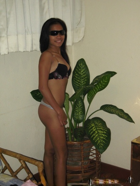 In the bathroom, chic Filipina Lyza Gubot is seen stripping before having sex.