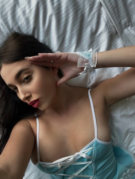 Glamorous OnlyFans star Katiiia models herself in her sexy nightgown and stockings.