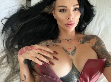 The babe, who is part of the TattooedFans cam, displays her impressive big tits in close-up.