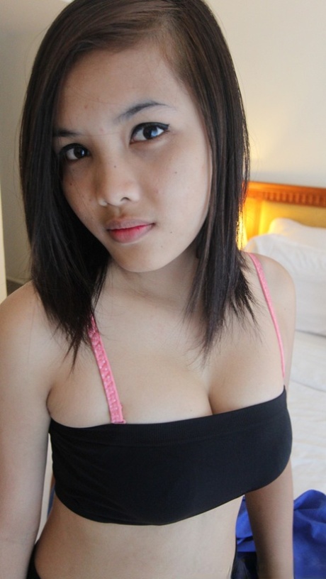 Rung, an Asian amateur showcasing her kinky skills in POV action, removes her blue dress and engages in sexual activity.