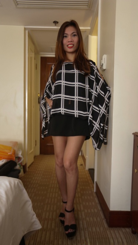 Slender Asian amateur: Shane shows off her good looks in a hotel room.