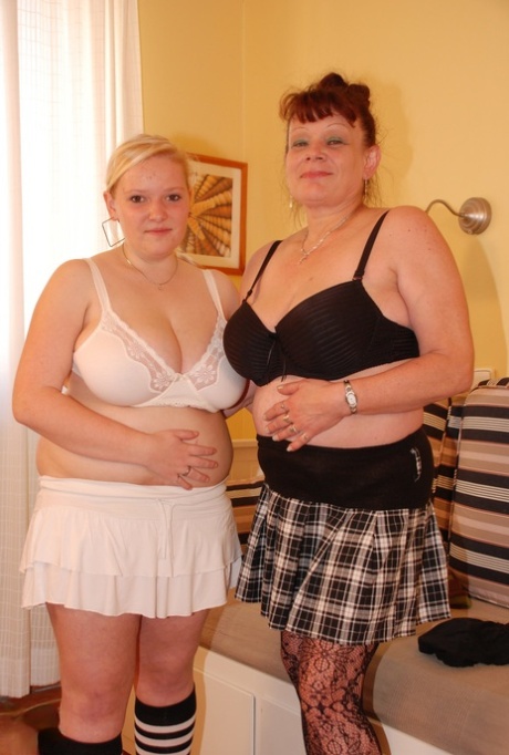 Lesbian BBWs Baram and Sandra C, with big breasts, give oral sex to each other.