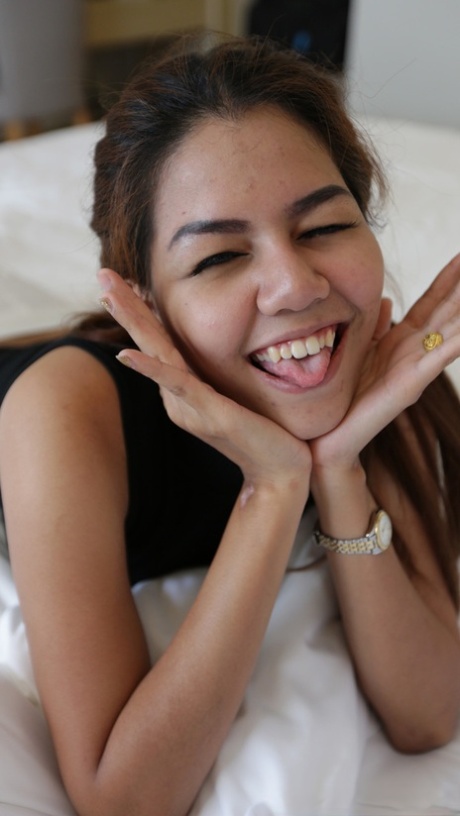Beautiful Kwan who is an amateur shows off her big breasts and gives them a blowjob.