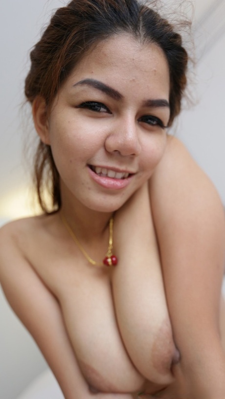 Beautiful Kwan, an amateur, flaunts her large breast tissue and performs fellatio.