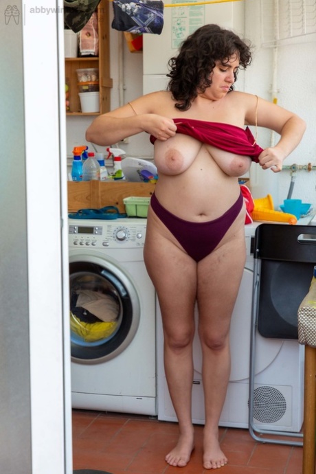 Chubby amateur babe Emily V gets spied on while dressing in the laundry room