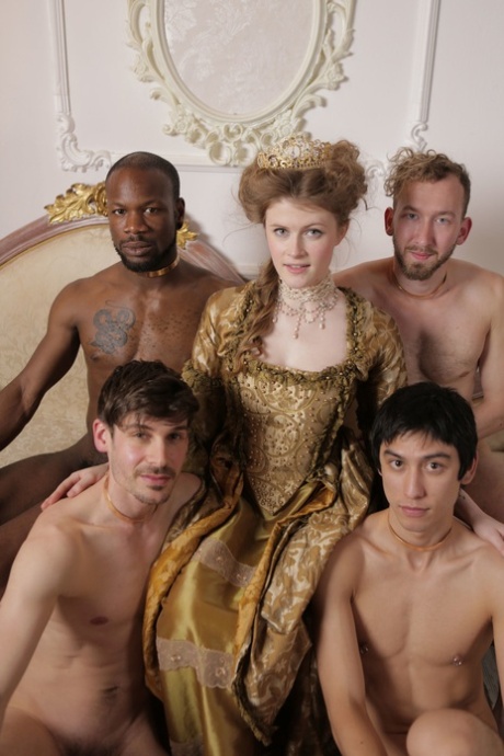 Kinky Queen With Big Tits Poses Naked With Her Servants On A Couch