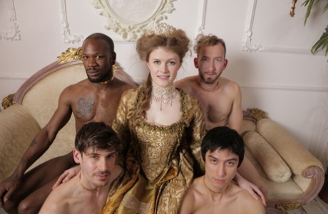 Kinky Queen With Big Tits Poses Naked With Her Servants On A Couch