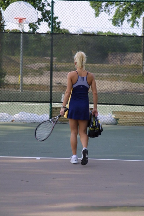 She displays her amazing breasts and gives a wicked head on court as an amateur tennis player.