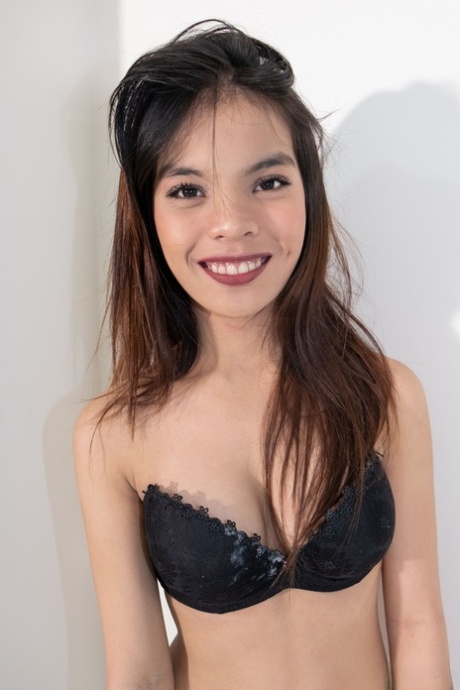 Faith, an Asian girl with a small butchery look, displays her natural breasts and booty without any visible features.