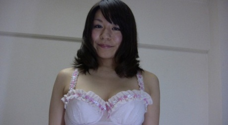 Yuka Kawashima, a delightful Asian beauty named MILF, exposes her large breasts and dispenses her hairy cuntilla.