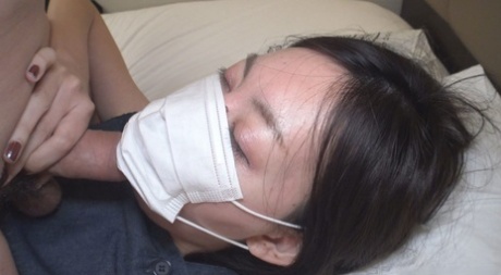 An unidentified and masked Japanese woman, Manami Honjyo, is given a thick coat and creampied on her furry companions.