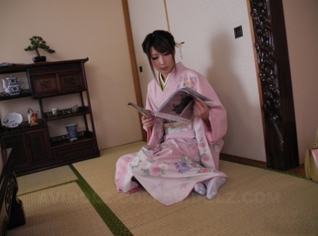 The hairy muff of Keiko Shinohara, a Japanese housewife, being touched by her partner during a solo performance.