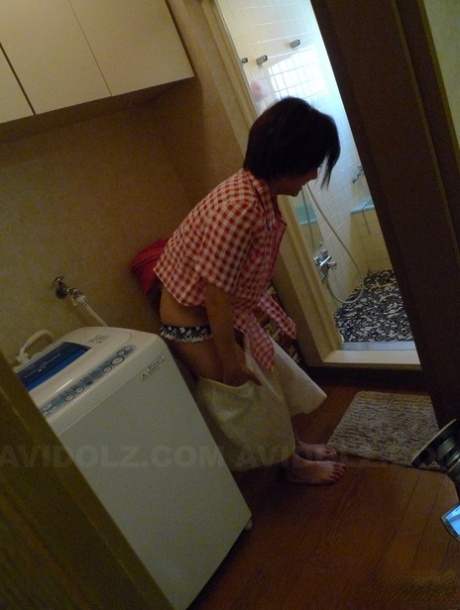 Meguru Kosaka, the Japanese housewife with short hair, is given a blowjob by her partner.