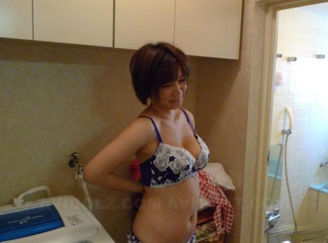 Ms. Kosaka, a Japanese housewife with short hair, receives sexual attention from her partner as she gets wet.