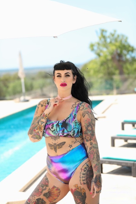 A tattooed, fat lady named Cherrie Pie was spotted by the pool, stripped down and posing in the nude.