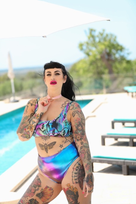 Despite her tattoo, Cherrie Pie is seen stripping and appearing nude by the pool.