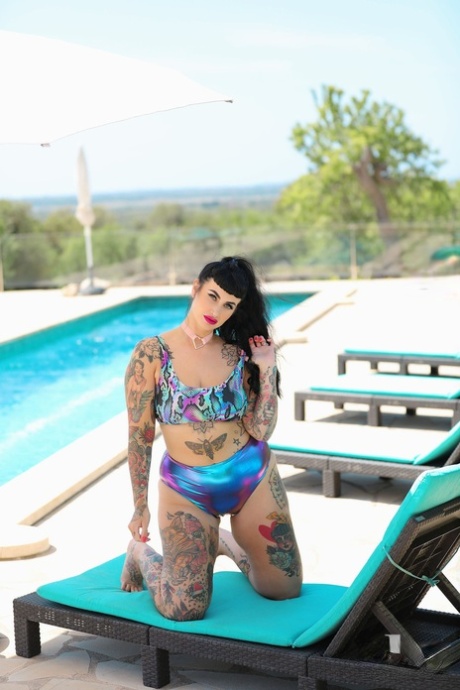Cherrie Pie, who has a tattoo and is overweight, was seen stripping and posing in the nude by the pool.