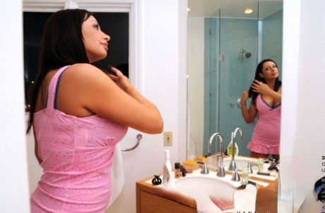 After posing in the mirror with her large breasts, amateur mature Vannah Sterling shows off her reflection.