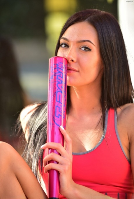 Sexy babe Marley flaunts her athletic body & toys with a baseball bat outside