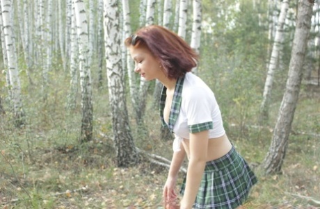 Redheaded Schoolgirl Stripping To Her White Stockings While On A Picnic