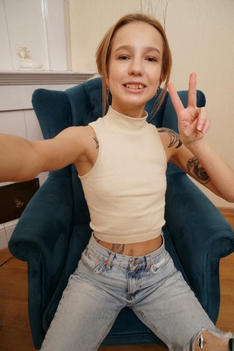 The slender midriff and freshly rubbed vagina pose for a selfie.