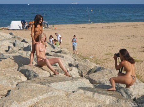 Without any shame, unadorned amateur girls pose for pictures in public while naked.