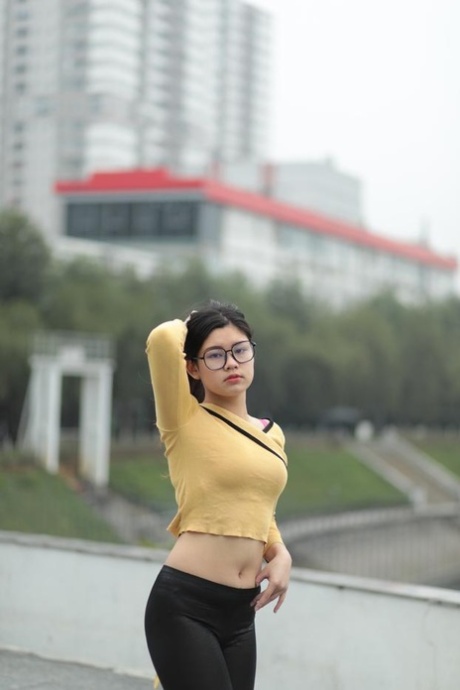 Beautiful Asian Girl Shows Off Her Perfect Body In A Sexy Outfit Outdoors