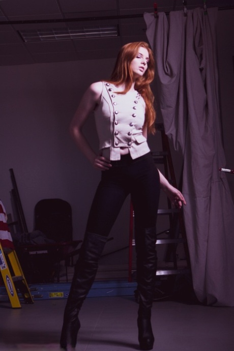 Redheaded Model Shaun Tia Posing In Her Sexy Blouse, Pants And High Heels