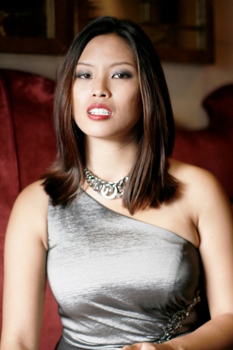 Breathtaking Asian Teen Zoey Jones Posing In Her Sexy Dress On The Sofa