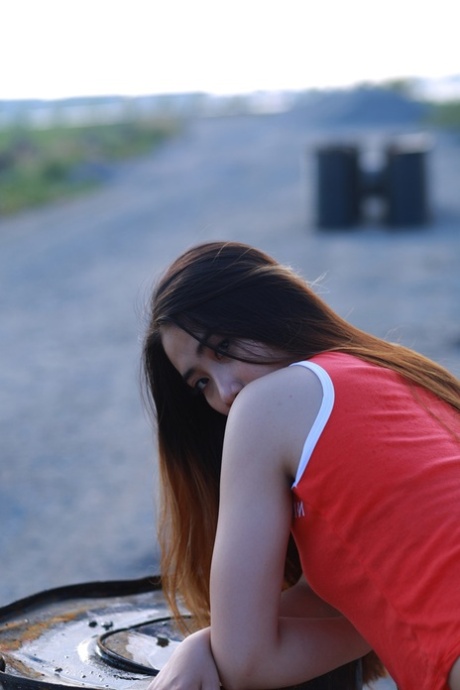 Attractive Asian Babe Posing Outdoors In Her Super Sexy Red Outfit