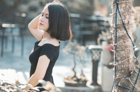 Glamorous Asian Babe Posing In Her Elegant Black Dress In Public