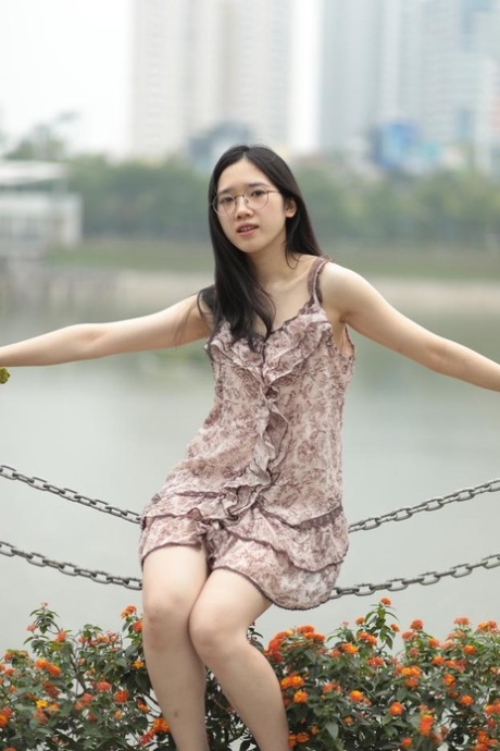 Eerie: A good-looking Asian hotchite in a seductive short dress dresses out for the day.