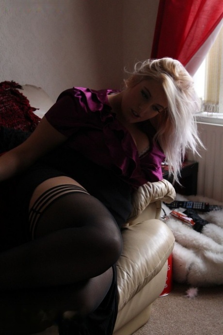 Cha-chic blonde in a seductive top, short skirt and nylon stockings.