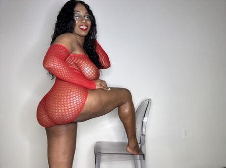 Fancy treats: The amateur Ebony Furystrikesback displays her big breast and thigh as she toys with cuddled bags.