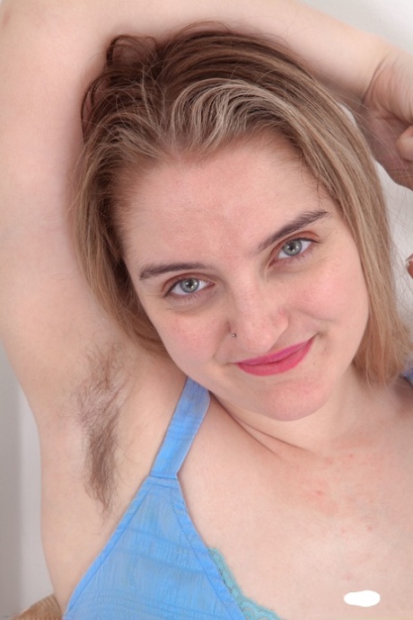 A naked Tamsin Riley exposes her hairy pussy in a messy and overweight manner.