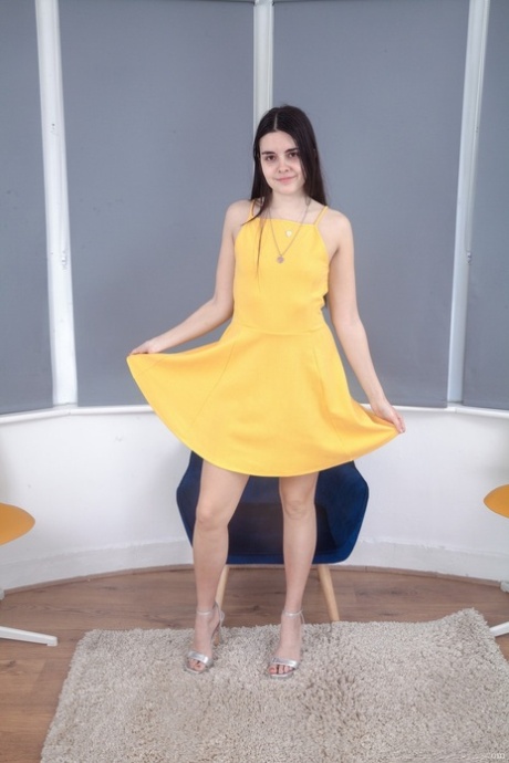 Shocked-making Zoe removes her yellow dress and shares her bushy twat with others.